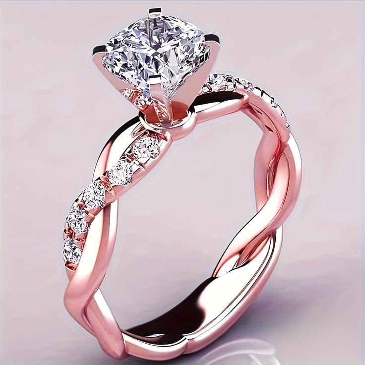 Anello da fidanzamento in oro rosa con banda intrecciata e diamanti pavé